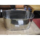 A large silver plated champagne bath of ovoid form 30 x 60 x 40