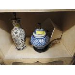 A blue and white oriental table lamp with shade along with white painted pictorial decoration (2)