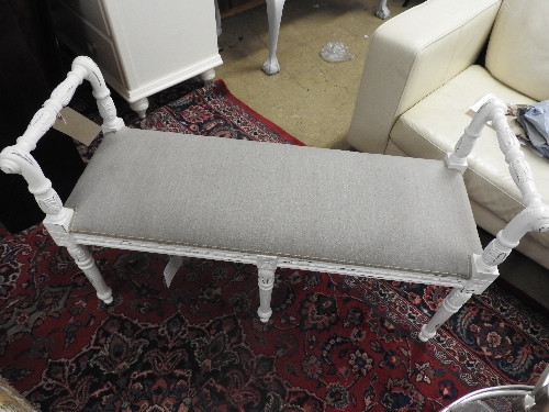 A contemporary window seat, the grey linen upholstered seat over six turned legs. 110cm (L) 68cm(h)