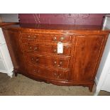 A 20th Century Georgain design yewood bowfronted inlaid side chest of four graduating drawers and