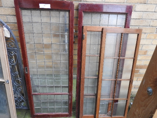 Two pairs of glass panel doors, one in mahogany, the other in teak (A/F two glass panels broken)