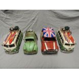 A pair of toy metal camper vans, along with a similar Beetle and Mini. 31cm (4)