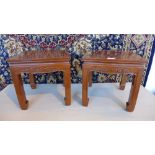 A pair of Oriental carved rosewood plant
