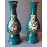 A pair of Chinese tall vases glazed gree