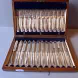 A walnut cased set of twelve silver plat