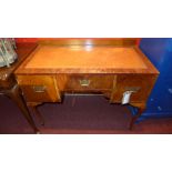 A walnut kneehole desk the tooled leathe