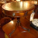 An occasional table with leather lined t