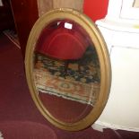 A Victorian wall mirror the oval bevelle