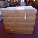 A vintage mahogany chest with a formica