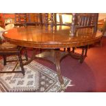A mahogany dining table the circular top
