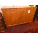 A teak Gordon Russell sideboard fitted t