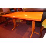 A red laminated low table the rectangula