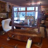 A Victorian flame mahogany toilet mirror the swing frame above pair of drawers with gilt metal