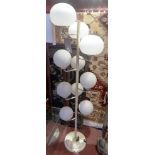 A retro mid 20th century white painted multi light floor standing lamp with ten spherical frosted