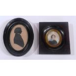 A portrait miniature of a girl in a walnut frame with gilded detail and a Victorian style