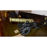 Two brass and cast iron model cannons of graduating sizes (2)