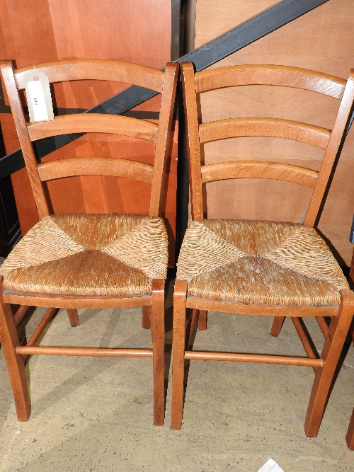 A set of six antique style farmhouse pine chairs with rush seats