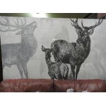 A contemporary image of stags of grand proportions with an indistinct background of a forest
