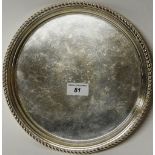 A modern circular silver salver, with moulded rim, the centre engraved 'T.J.P.