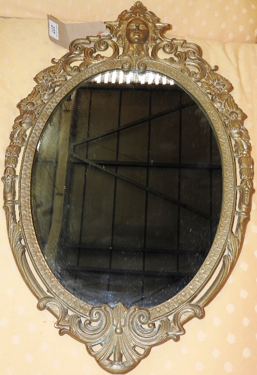 An early 20th century French gilt metal wall mirror the oval plate within pierced frame 
H 67cm x W