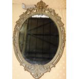 An early 20th century French gilt metal wall mirror the oval plate within pierced frame 
H 67cm x W