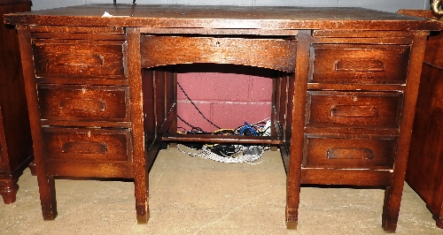 An early 20th century oak kneehole desk,