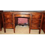 An early 20th century oak kneehole desk,