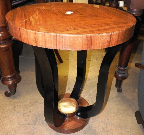 A pair of 20th century Art Deco style lamp tables the circular veneered tops over ebonised