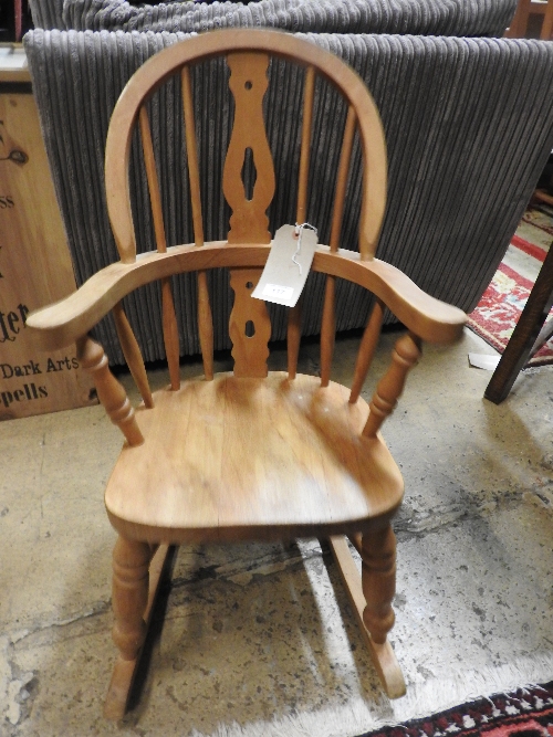A C20th pine child's rocking chair D 42cm x H 62cm