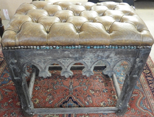 A Gothic Revival pitch pine stool with leather seat 60cm x 52cm