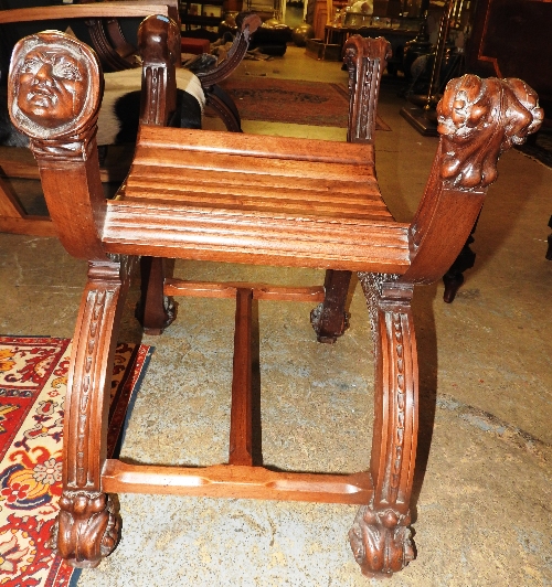 A pair of late of 19th century French carved walnut stools,