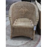 A modern wicker tub form conservatory chair