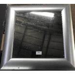 A contemporary silvered frame mirror and one other with a brown leather stitched frame
60cm x 60cm