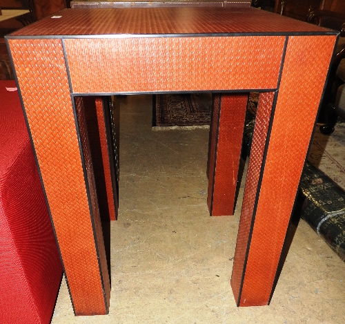 A contemporary design red leather occasional table,