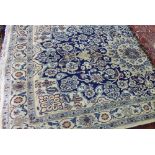 An extremely fine part silk Nain rug, the central diamond floral ivory medallion,