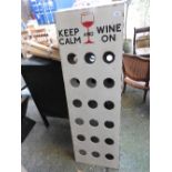 A large 18 bottle wine rack,