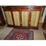 A 19th century George IV rosewood and giltwood side cabinet of breakfront outline,