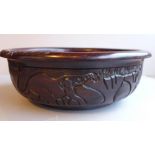 A Tanzanian rosewood bowl carved to the exterior, Dia. 33cm.