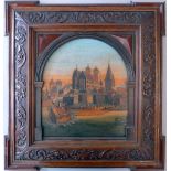 A 19th Century carved and stained treen medieval town scene in an oak carved frame,