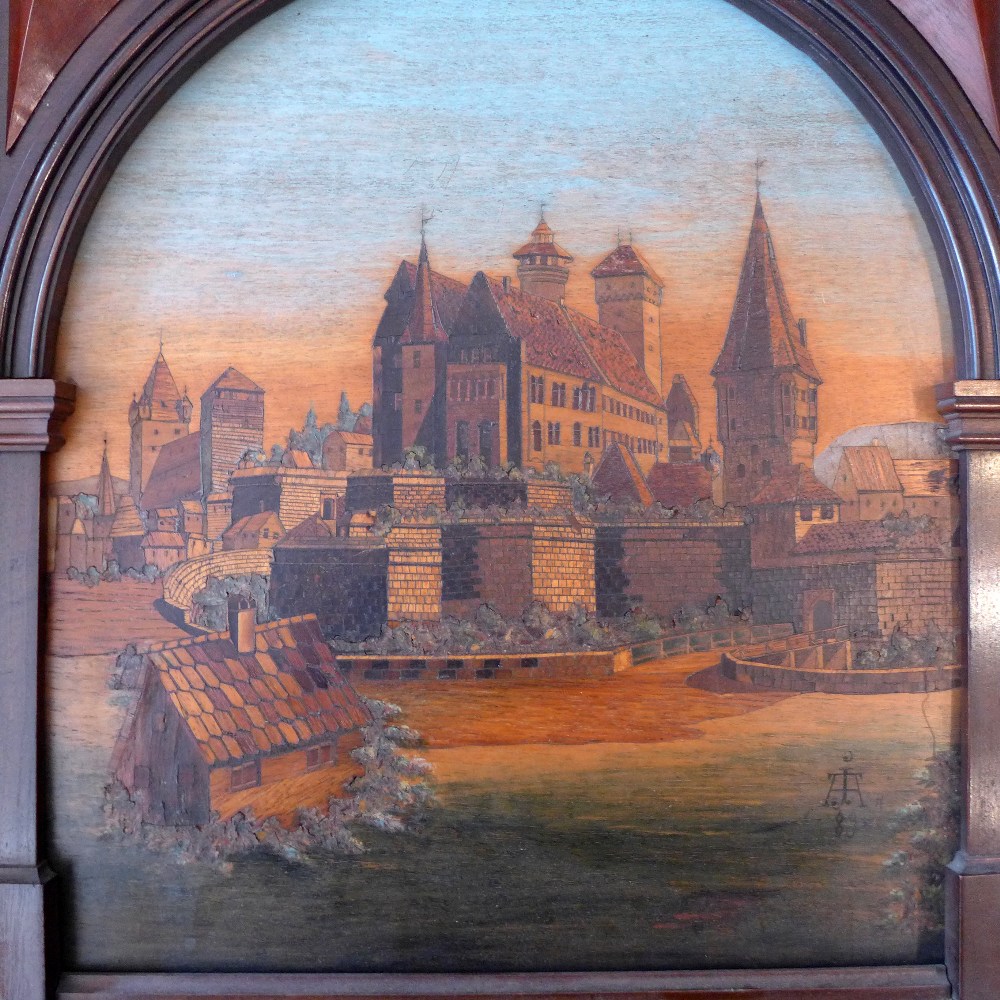 A 19th Century carved and stained treen medieval town scene in an oak carved frame, - Image 2 of 2