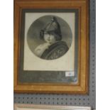 A framed and glazed monochrome print of a helmeted young child entitled "The Amazon",