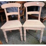 Two recently constructed wooden farmhouse chairs