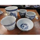 A quantity of blue and white porcelain vases to include Oriental examples and also a bucket by