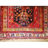 A Persian Qashqai rug in an Arts and Crafts design,