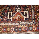 An antique Persian Quashqai rug the geometric design within tribal border 210cm x 135cm