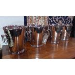 A set of four silver plated wine coolers with ring handles