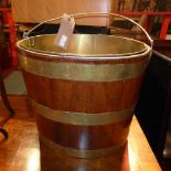 A mahogany and brass coopered peat bucket,