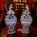 A large pair of Delft lidded vases decorated in the Oriental manner (as found).