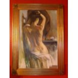 A contemporary oil on canvas of a semi nude female looking in a mirror, in gilt frame.