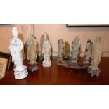 A collection of Chinese carved soapstone figures, a Blanc de Chine figure and similar others.